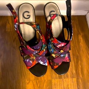 Guess floral wedges with wicker bottom. Size 11
